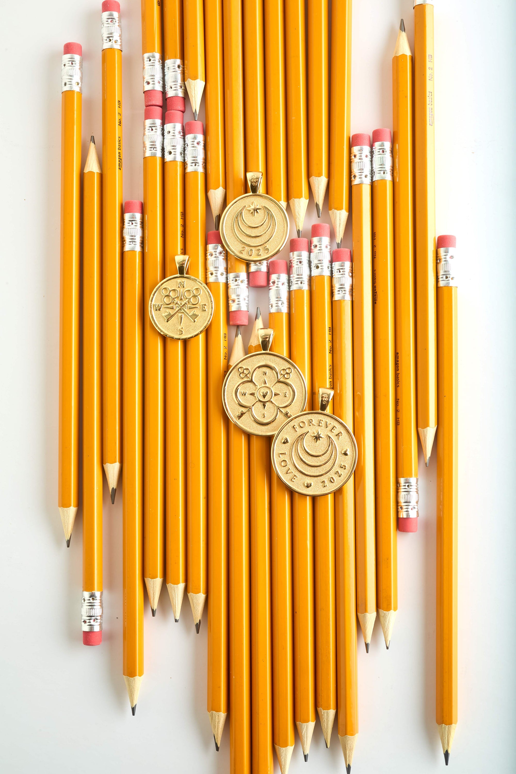 Graduation jewelry from Jane Win over pencils