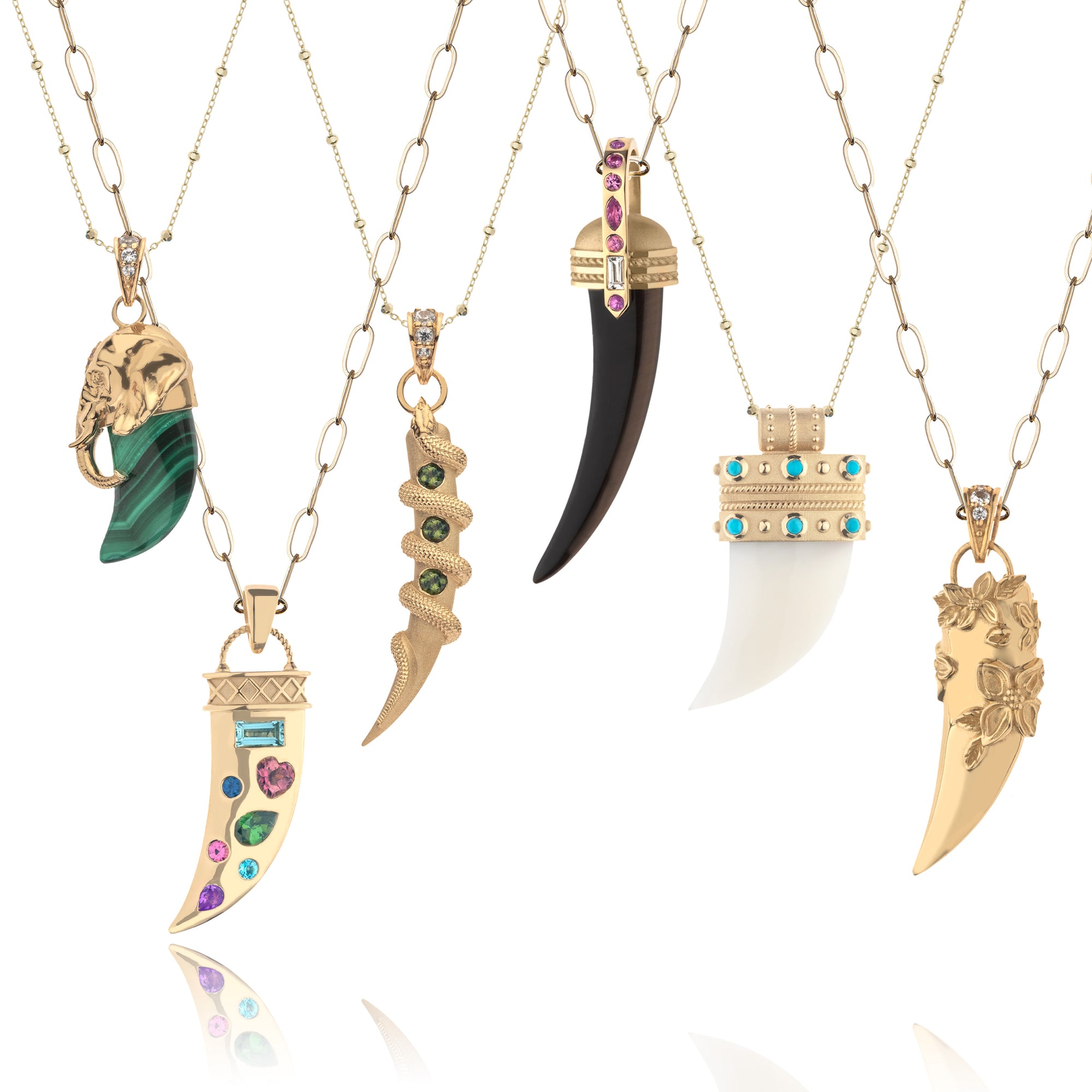 Various tusk pendants on different chains