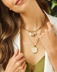 Model wearing the gratitude tile coin and the gratitude charm set