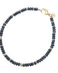 Obsidian beaded necklace with gold bead accents and oversized gold lobster clasp