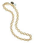 Gold chunky link chain necklace features twisted links, oversized clasp, and mother of pearl bead