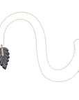 Carved onyx feather pendant on 10 karat adjustable chain
