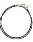 Double wrapped beaded chain of black opal beads with oversized gold lobster clasp