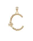 Gold letter C pendant with flower detail and white topaz accents on the bail