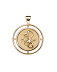 Gold coin pendant with the sea goat that represents the Capricorn zodiac sign