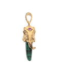 Side view of gold and malachite tusk shows elephant face featuring pink tourmaline detail