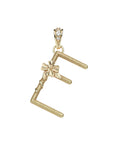 Gold letter E pendant with flower detail and white topaz accents on the bail