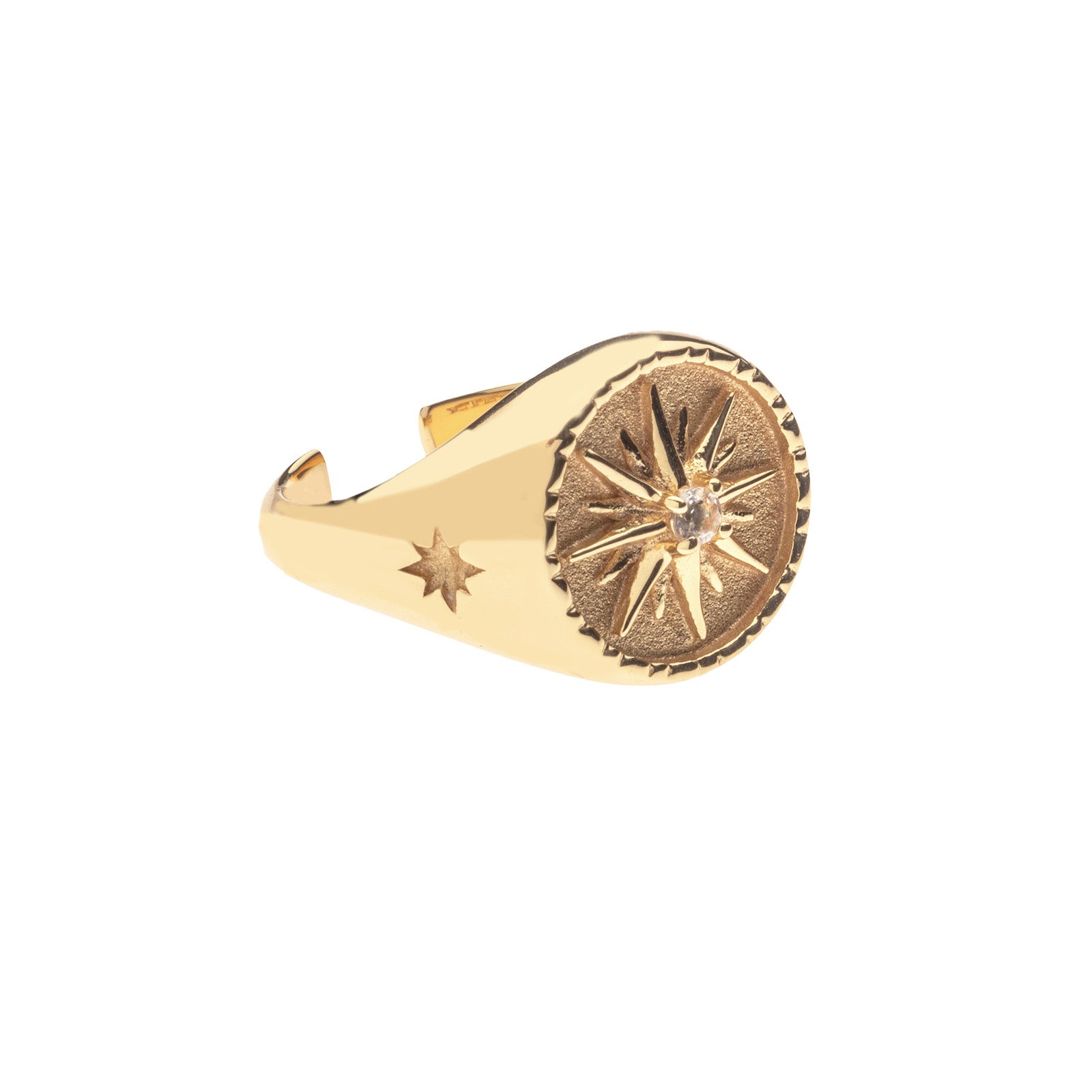 Side view of gold sundial signet ring shows star detail on the side
