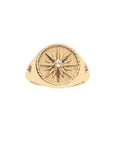 Gold sundial signet ring with white topaz detail