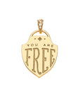 Back of gold shield pendant features the phrase "YOU ARE FREE"