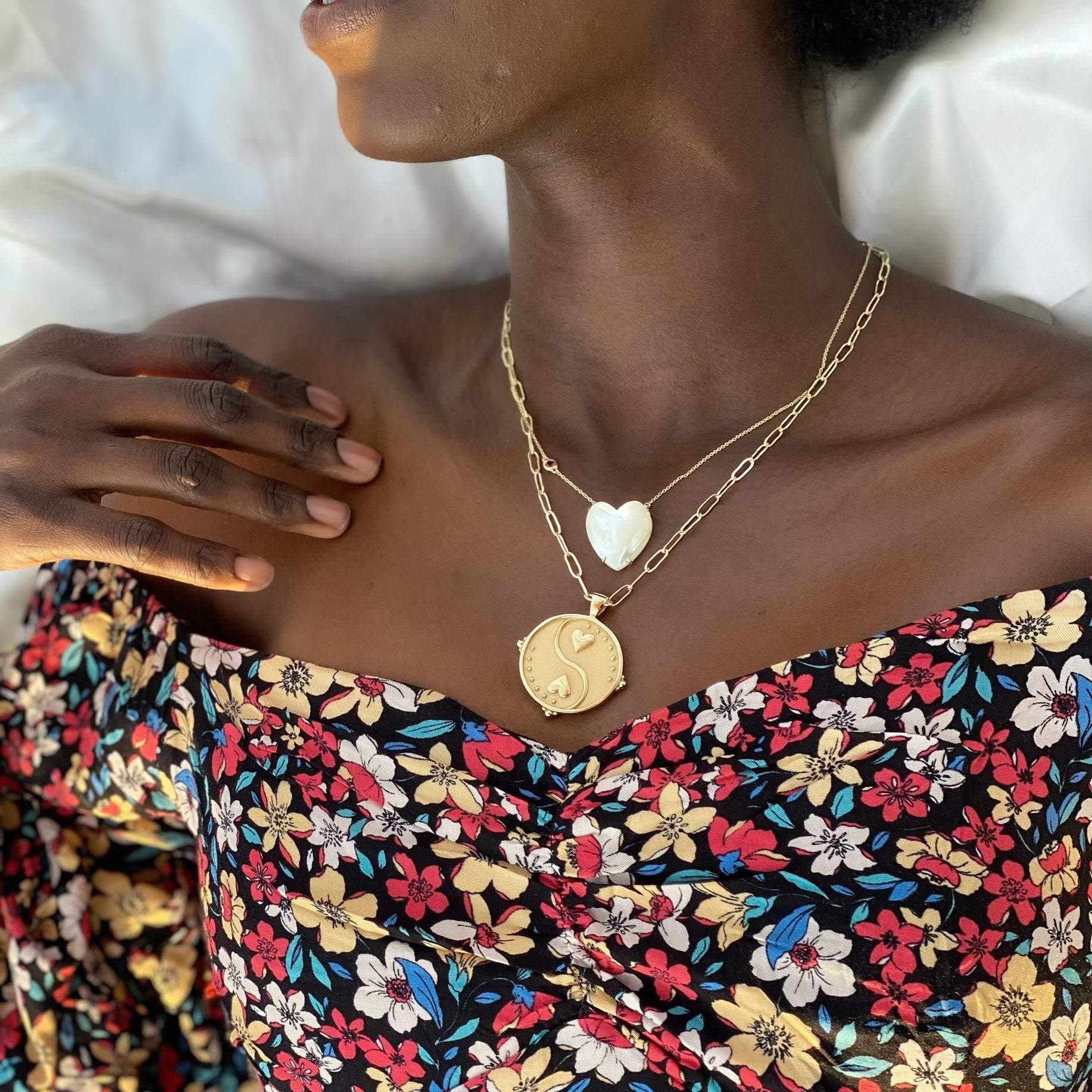 Gold Coin Necklace and Heart Necklace Layered on Model Neck