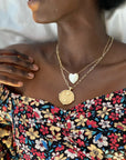 Gold Coin Necklace and Heart Necklace Layered on Model Neck