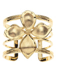 Gold cuff bracelet featuring dogwood flower