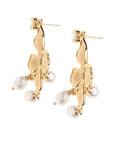 Side view of dogwood and pearl drop earring