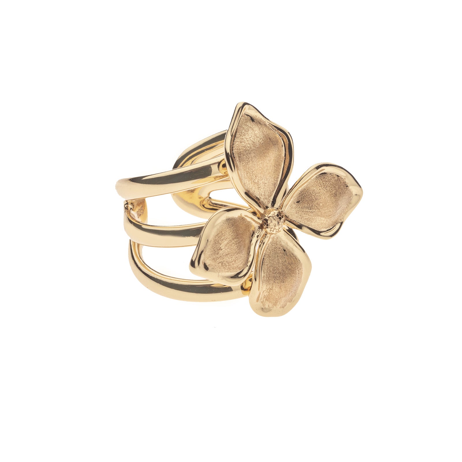 Gold ring features dogwood flower
