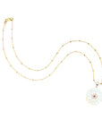Carved mother of pearl daisy on 14 karat satellite chain