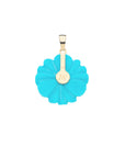 Back of carved turquoise daisy shows gold setting