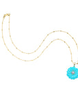 Carved daisy on 14 karat satellite chain