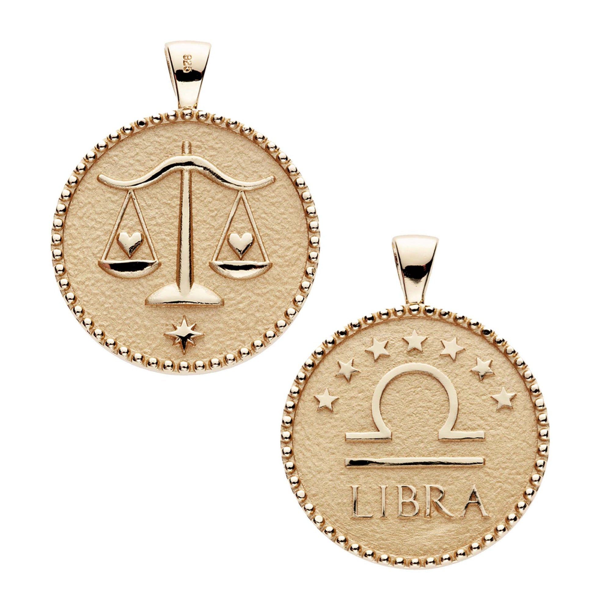 Gold original Libra coin pendant features balanced scales holding hearts on one side and the Libra symbol with stars above it and "Libra" written underneath on the other side