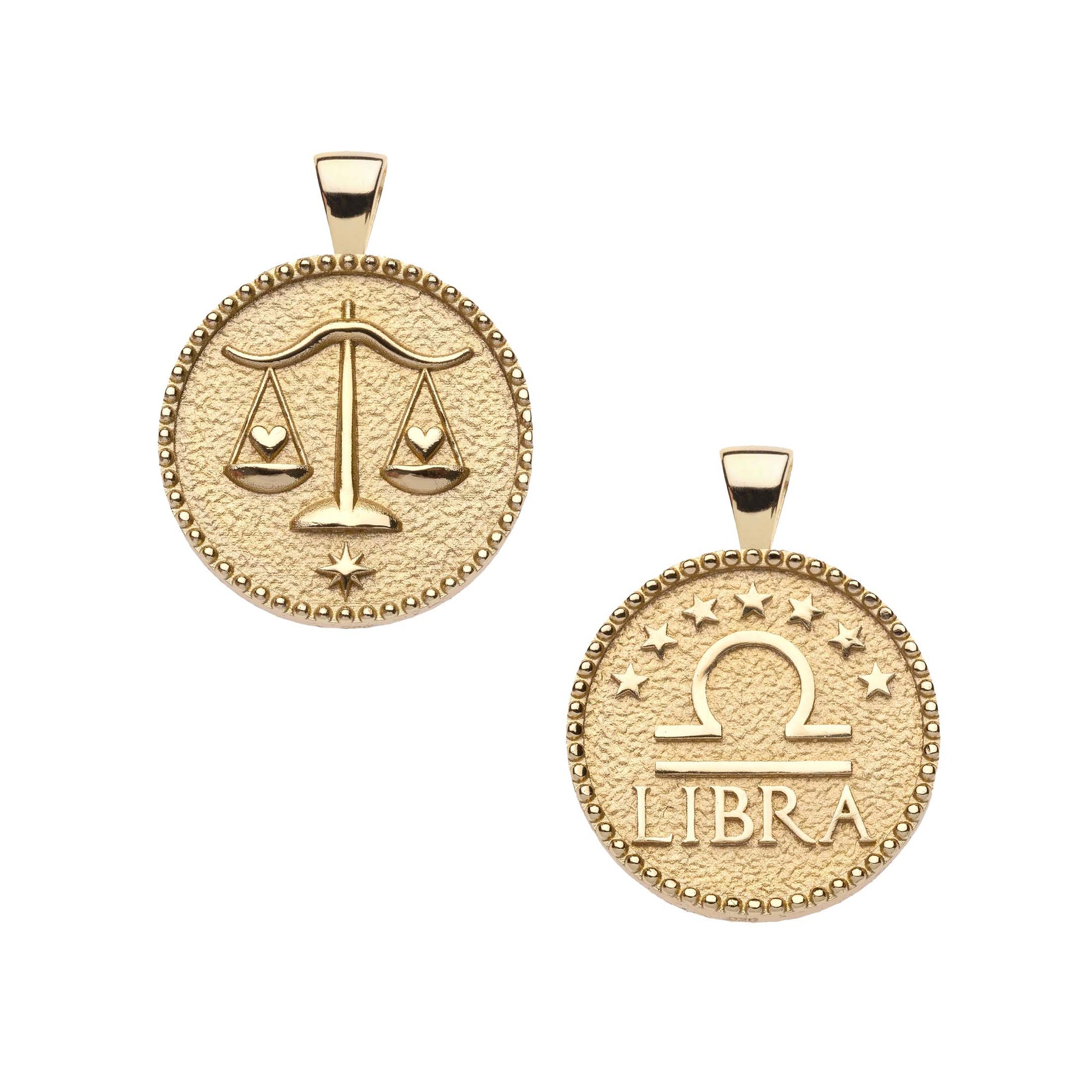 Gold small Libra coin pendant features balanced scales holding hearts on one side and the Libra symbol with stars above it and "Libra" written underneath on the other side