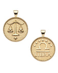 Gold small Libra coin pendant features balanced scales holding hearts on one side and the Libra symbol with stars above it and "Libra" written underneath on the other side