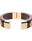 Side view of wood bangle shows magnet closure set in gold