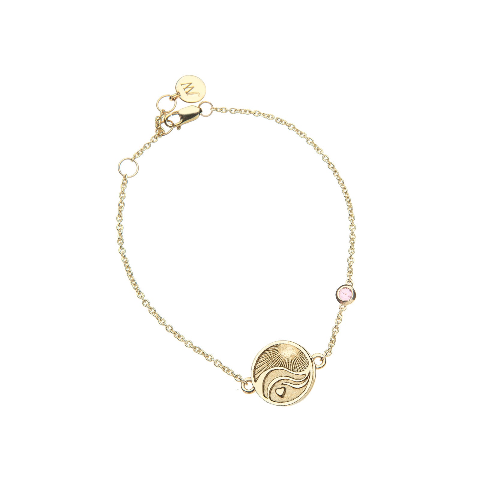 Gold chain bracelet featuring mini coin with illustration of the sun, waves, and a heart with pink tourmaline accent on chain