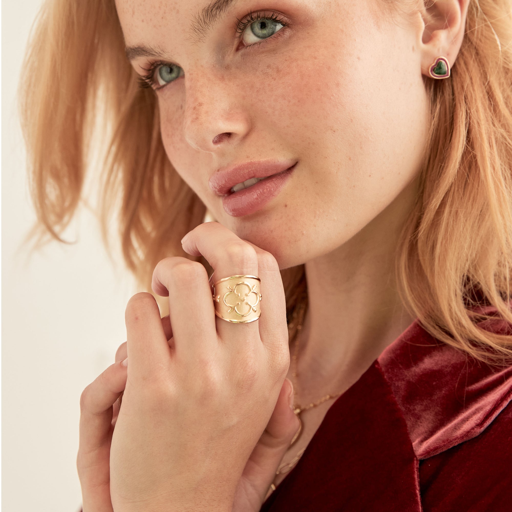 Model wearing gold love cigar band ring