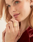Model wearing gold love cigar band ring