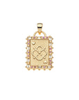 Gold playing card pendant features embellished edge of white topaz and pink tourmaline. Center of card features quatrefoil design with arrows and hearts