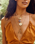 Gold Coin Necklaces Layered on Model