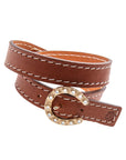 Back of brown leather wrap bracelet shows horseshoe buckle closure with mother of pearl accents