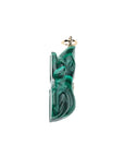 Side view of carved malachite frog