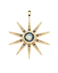 Gold sparkling supernova pendant features black mother of pearl cabochon at the center and smoky topaz and white topaz accents on the stars 10 points