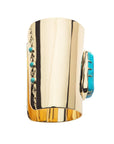 Side view of cuff shows turquoise nugget at the front and small turquoise stones and moon and star details on the back