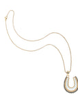 Gold and mother of pearl horseshoe pendant on classic rolo chain