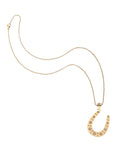 Gold lucky horseshoe pendant on classic rolo chain