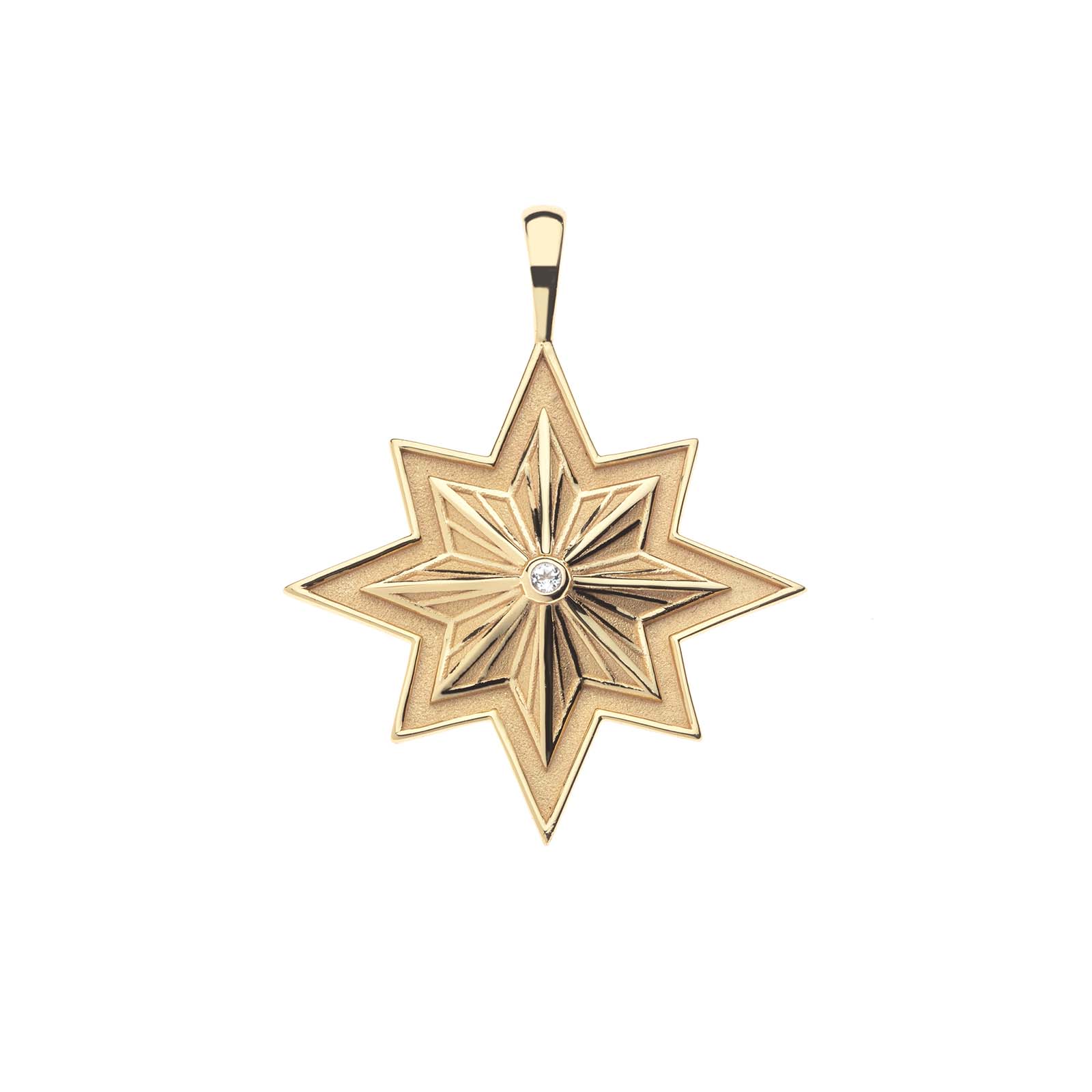 Gold 8 point star pendant with white topaz center stone