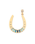 Gold horseshoe pendant with 7 baguette stones of aquamarine, topaz, and sapphire stones