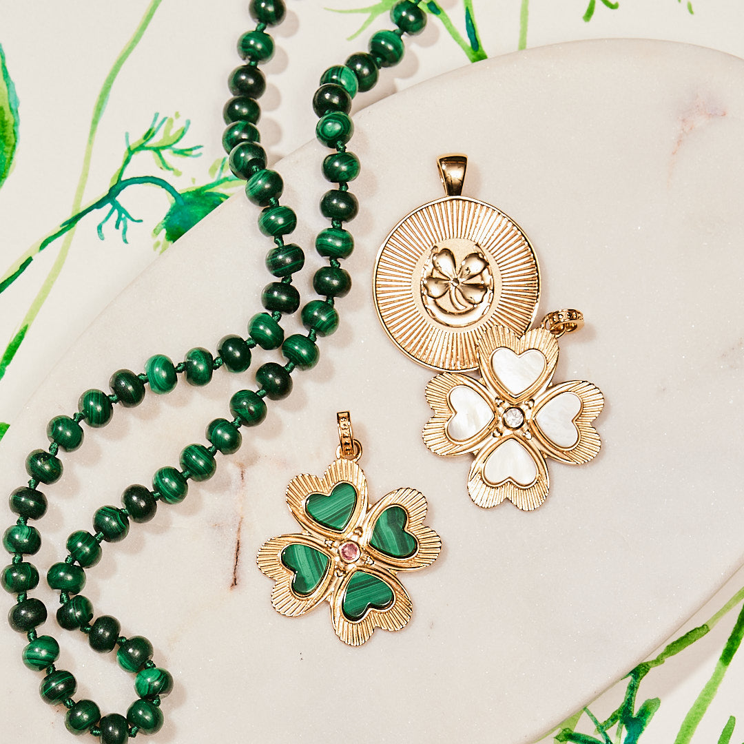 Four leaf clover pendants with gold original lucky coin