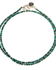 Double wrapped beaded necklace featuring malachite beads and flat gold beads. Necklace features oversized gold lobster clasp.