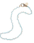Pearl necklace on knotted turquoise cord with gold clasp