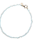Pearl necklace on knotted turquoise cord with gold clasp