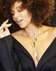 Model wearing various tusk pendants