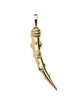 Gold tusk pendant with evil eye and star details. Center of evil eyes feature blue sapphire stone.
