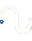 Carved lapis evil eye pendant on 10 karat adjustable chain