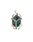 Onyx carved scarab pendant with emerald accents and gold legs and bail