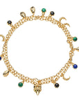Gold double wrapped chain featuring crescent moon, fox, scarab, malachite, onyx, and lapis charms