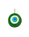 Green Murano glass evil eye pendant featuring gold bail with white topaz stones