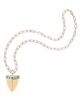 Gold shark tooth pendant on the drawn link chain